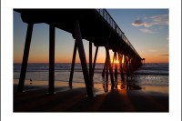 The sun sets behind Hermosa Beach pier in Los Angeles.
